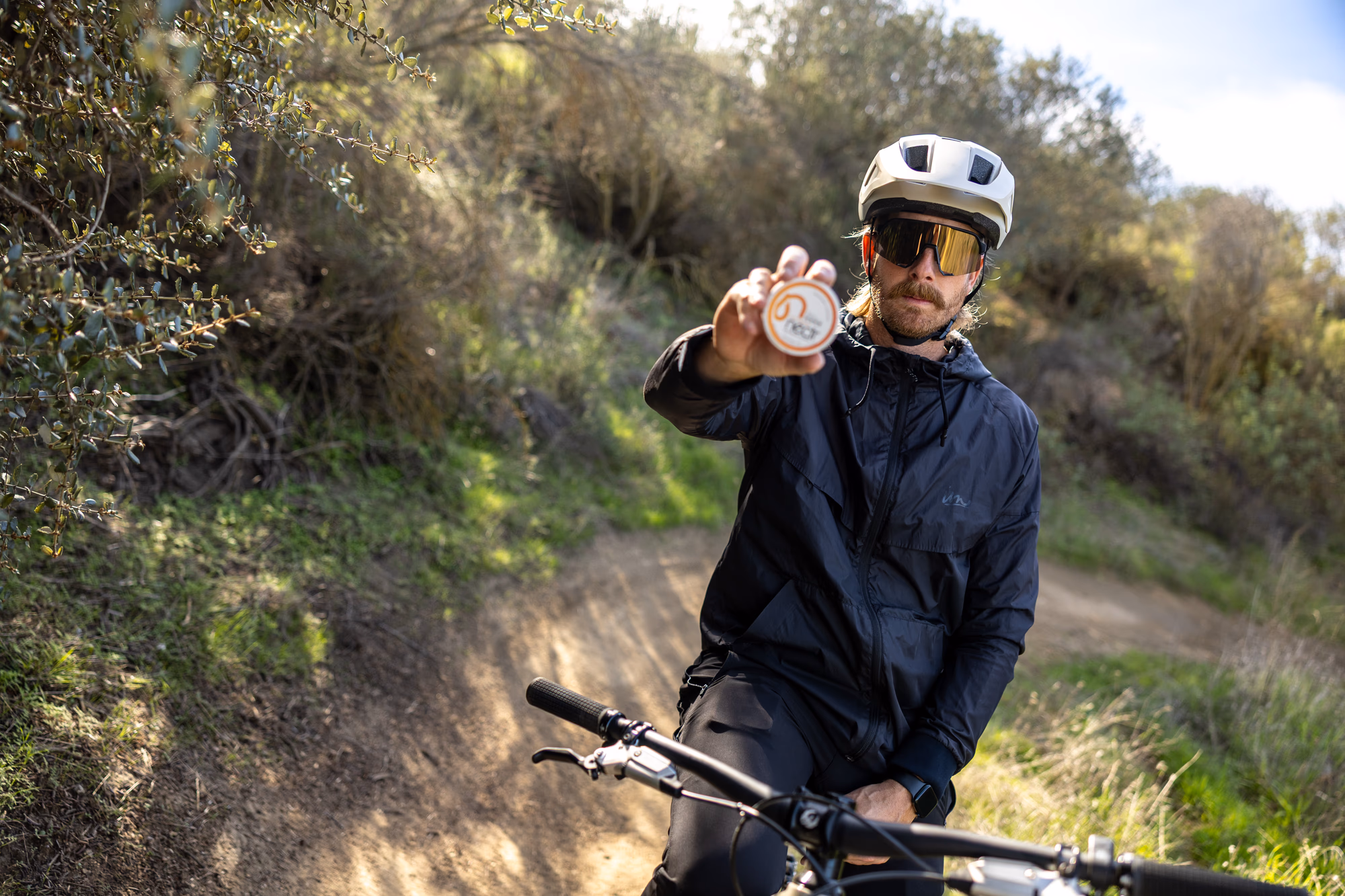 Customer holding a tin of Nectr Energy Nicotine-Free Pouches